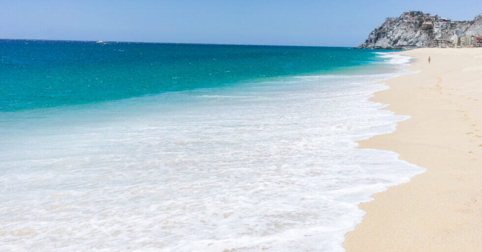 Aerial view of a Los Cabos beach where the Pacific meets the Sea of Cortez
