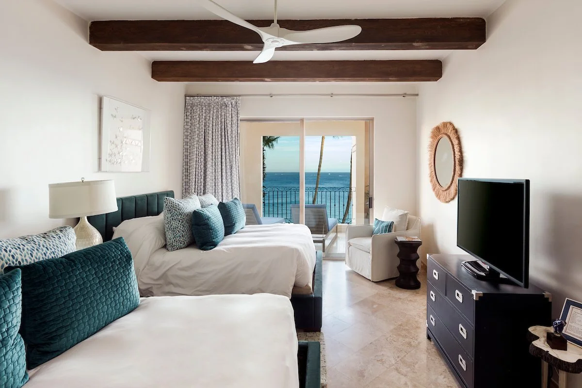Guest bedroom in Villa La Estancia 3301 with two queen beds and an ocean view