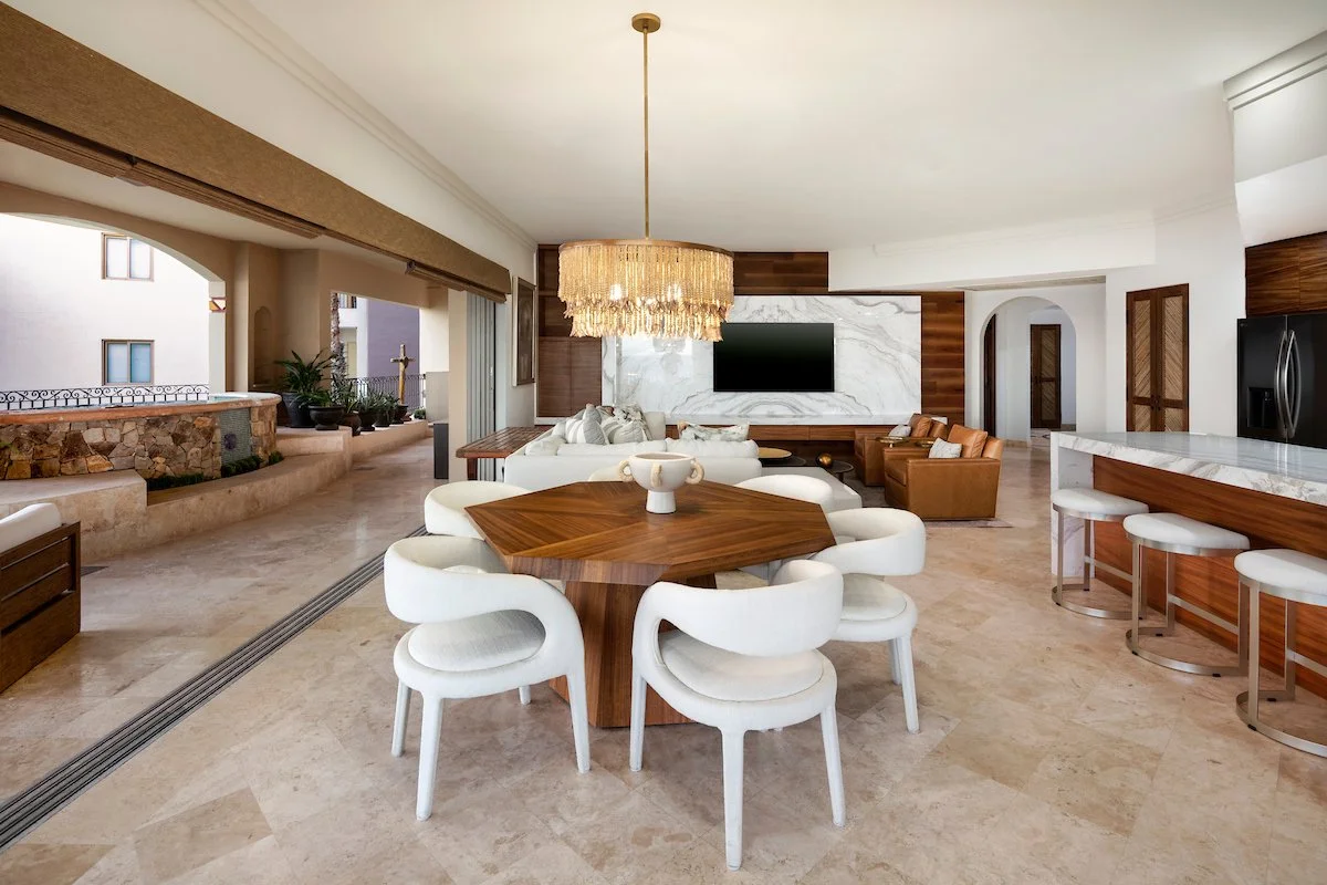 Open-plan kitchen, dining and living area in Villa La Estancia 3301 with the terrace beyond